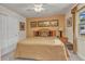 Inviting bedroom with a comfortable bed, window, and closet, creating a cozy and relaxing space at 2541 Northway Dr, Venice, FL 34292