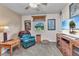 Comfortable bedroom featuring a cozy chair and a television, creating a relaxing living space at 2541 Northway Dr, Venice, FL 34292