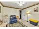 Cozy bedroom features a floral border, a ceiling fan, and neutral carpeting at 2541 Northway Dr, Venice, FL 34292