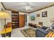 Bedroom with a window and floral border has a built in wardrobe and access to the closet at 2541 Northway Dr, Venice, FL 34292