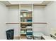 Walk-in closet with white shelving offers ample storage at 2541 Northway Dr, Venice, FL 34292