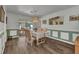 Elegant dining room with a chandelier, wainscoting, and access to the screened porch at 2541 Northway Dr, Venice, FL 34292