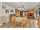 Inviting dining room features wood floors, a fireplace, and a table with seating for four at 2541 Northway Dr, Venice, FL 34292