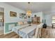 Charming dining room featuring a decorative chandelier, wood flooring, and ample lighting at 2541 Northway Dr, Venice, FL 34292