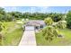 A beautiful home with solar panels, a two-car garage, and a landscaped yard at 2541 Northway Dr, Venice, FL 34292