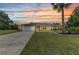 Charming single-story home with attached garage, solar panels, and manicured lawn at 2541 Northway Dr, Venice, FL 34292