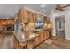 Kitchen featuring wood cabinets, modern appliances, and counter seating at 2541 Northway Dr, Venice, FL 34292
