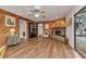 The spacious living room offers wood floors and a fireplace, creating a warm and inviting atmosphere at 2541 Northway Dr, Venice, FL 34292