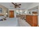 Comfortable main bedroom boasts neutral carpeting, a ceiling fan, and ample natural light at 2541 Northway Dr, Venice, FL 34292