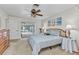 Bright and airy main bedroom features a ceiling fan and a sliding glass door to the lanai at 2541 Northway Dr, Venice, FL 34292