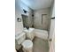 Bathroom featuring modern tiled shower and tub, updated vanity, and matte black hardware at 300 Dalton Blvd Blvd, Port Charlotte, FL 33952