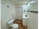 Bathroom featuring a new vanity, toilet, and sliding closet doors at 300 Dalton Blvd Blvd, Port Charlotte, FL 33952