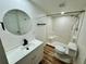 Bathroom featuring modern vanity, toilet, tiled shower, and matte black hardware at 300 Dalton Blvd Blvd, Port Charlotte, FL 33952