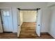 View of a light-filled bedroom featuring beautiful hardwood floors, seamlessly connected through sliding doors at 300 Dalton Blvd Blvd, Port Charlotte, FL 33952
