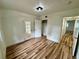Bright bedroom featuring new closet and stylish wood-look flooring at 300 Dalton Blvd Blvd, Port Charlotte, FL 33952