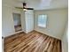 Bedroom featuring a window, closet, and stylish wood-look flooring at 300 Dalton Blvd Blvd, Port Charlotte, FL 33952