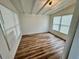Bright bedroom with hardwood floors, recessed lighting, and large windows providing natural light and views at 300 Dalton Blvd Blvd, Port Charlotte, FL 33952