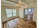 Cozy bedroom with hardwood floors and sliding door access to the kitchen area for convenient living at 300 Dalton Blvd Blvd, Port Charlotte, FL 33952