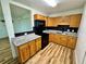 Well-equipped kitchen with granite countertops, modern appliances, and ample cabinet space for storage at 300 Dalton Blvd Blvd, Port Charlotte, FL 33952