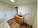 Bright laundry room with wood-look flooring and a modern utility sink at 300 Dalton Blvd Blvd, Port Charlotte, FL 33952