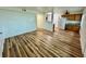 Spacious living room with hardwood floors and abundant natural light, seamlessly connected to the kitchen area at 300 Dalton Blvd Blvd, Port Charlotte, FL 33952