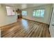 Bright and airy living room featuring hardwood floors and large windows with views of the neighborhood at 300 Dalton Blvd Blvd, Port Charlotte, FL 33952