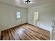 Room with stylish wood-look floors, white walls, and a door to the exterior at 300 Dalton Blvd Blvd, Port Charlotte, FL 33952