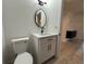 Updated powder bath with new vanity and fixtures, granite countertop, and lighting at 4300 Avanti Cir, North Port, FL 34287