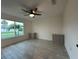 Bedroom with natural light, ceiling fan, and tiled flooring at 4300 Avanti Cir, North Port, FL 34287