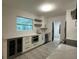 Updated kitchen featuring sleek white cabinets, stainless appliances, wine cooler, and stone countertops at 4300 Avanti Cir, North Port, FL 34287