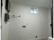 Bright laundry room featuring connections for laundry equipment and a small window at 4300 Avanti Cir, North Port, FL 34287