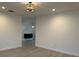 Open living area with wood-look floors and modern lighting, creating a welcoming space at 4300 Avanti Cir, North Port, FL 34287