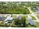 A serene residential neighborhood with lush greenery and well-spaced homes at 7104 Castilla St, Port Charlotte, FL 33981