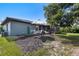 Backyard view showcasing patio set, covered patio area, and privacy at 7104 Castilla St, Port Charlotte, FL 33981