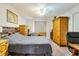 Bedroom with a wood headboard, wood dresser, and ceiling fan at 7104 Castilla St, Port Charlotte, FL 33981