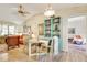 Charming dining area featuring a glass table, decorative hutch, and views into the adjacent living spaces at 7104 Castilla St, Port Charlotte, FL 33981