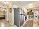 Kitchen with stainless steel refrigerator and appliances, and an opening to the dining area at 7104 Castilla St, Port Charlotte, FL 33981