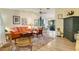 Inviting living room with neutral walls, wood floors, and comfortable seating arrangement at 7104 Castilla St, Port Charlotte, FL 33981