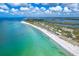 Breathtaking aerial view of a beach community with stunning ocean and bay views at 7500 Palm Island S Dr # 2111, Placida, FL 33946