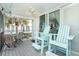 Screened balcony with seating and partial ocean view at 7500 Palm Island S Dr # 2111, Placida, FL 33946