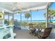 Screened balcony with seating and ocean view at 7500 Palm Island S Dr # 2111, Placida, FL 33946