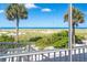 A screened-in porch provides a scenic view of the sandy beach and ocean at 7500 Palm Island S Dr # 2111, Placida, FL 33946