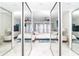 Mirrored closet reflects the bedroom with coastal decor, ceiling fan and ocean views at 7500 Palm Island S Dr # 2111, Placida, FL 33946
