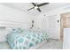 Bright bedroom with tile floors, white walls, ceiling fan, and ample closet space at 7500 Palm Island S Dr # 2111, Placida, FL 33946