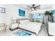Bright bedroom with ocean view, coastal decor, and large windows at 7500 Palm Island S Dr # 2111, Placida, FL 33946
