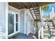 Condo entrance featuring stylish stairs and a secure, well-lit doorway at 7500 Palm Island S Dr # 2111, Placida, FL 33946
