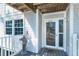 Welcoming condo entrance with a charming nautical theme and storm door access at 7500 Palm Island S Dr # 2111, Placida, FL 33946