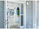 Bright foyer boasting sleek tile flooring and a coastal-themed surfboard decor accent at 7500 Palm Island S Dr # 2111, Placida, FL 33946