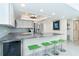 Chic kitchen featuring an island with bar seating and modern stainless steel appliances at 7500 Palm Island S Dr # 2111, Placida, FL 33946