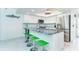 Stylish kitchen featuring white cabinetry, stainless steel appliances and bar seating at 7500 Palm Island S Dr # 2111, Placida, FL 33946